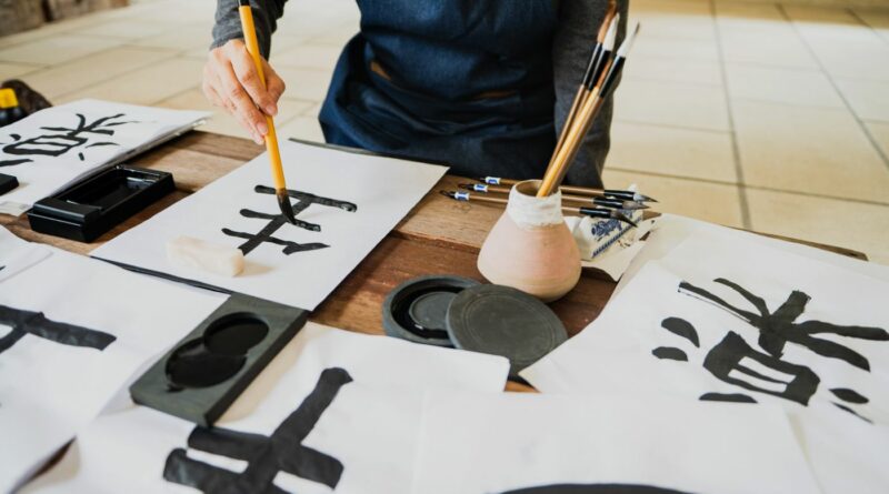 A person painting calligraphy